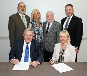 AOAC INTERNATIONAL Executive Director Dave Schmidt and NMKL Secretary-General Nina Skall Nielsen signing the agreement